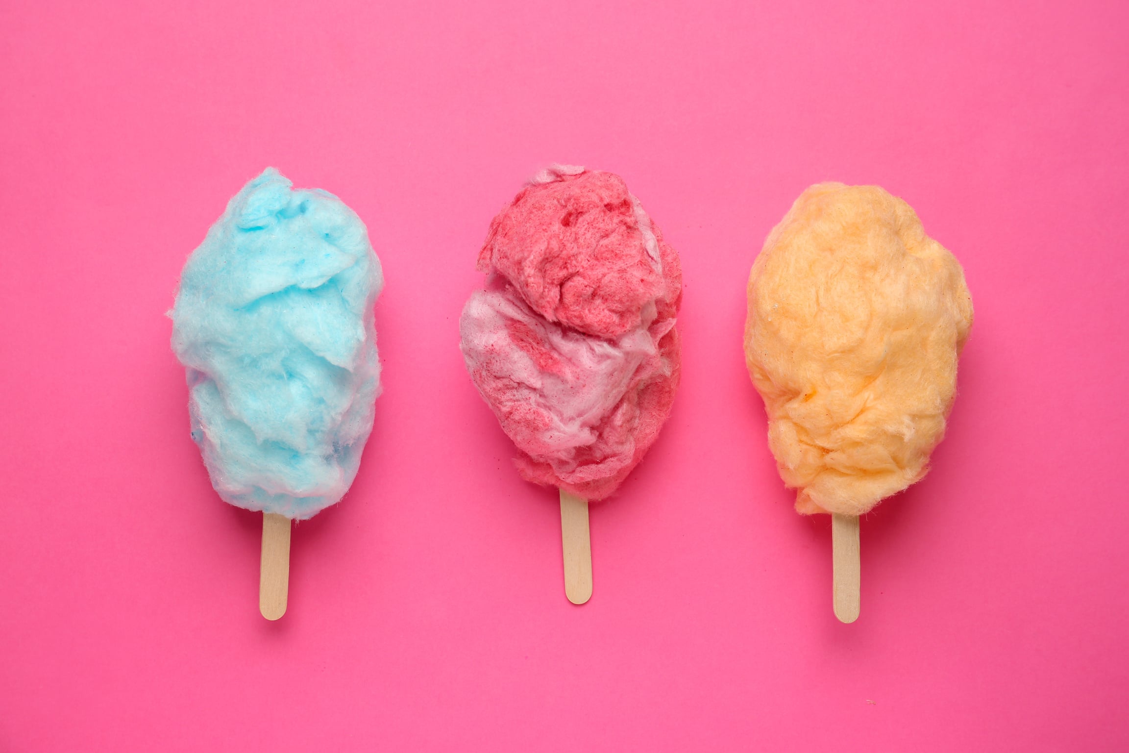 Tasty Cotton Candy on Color Background